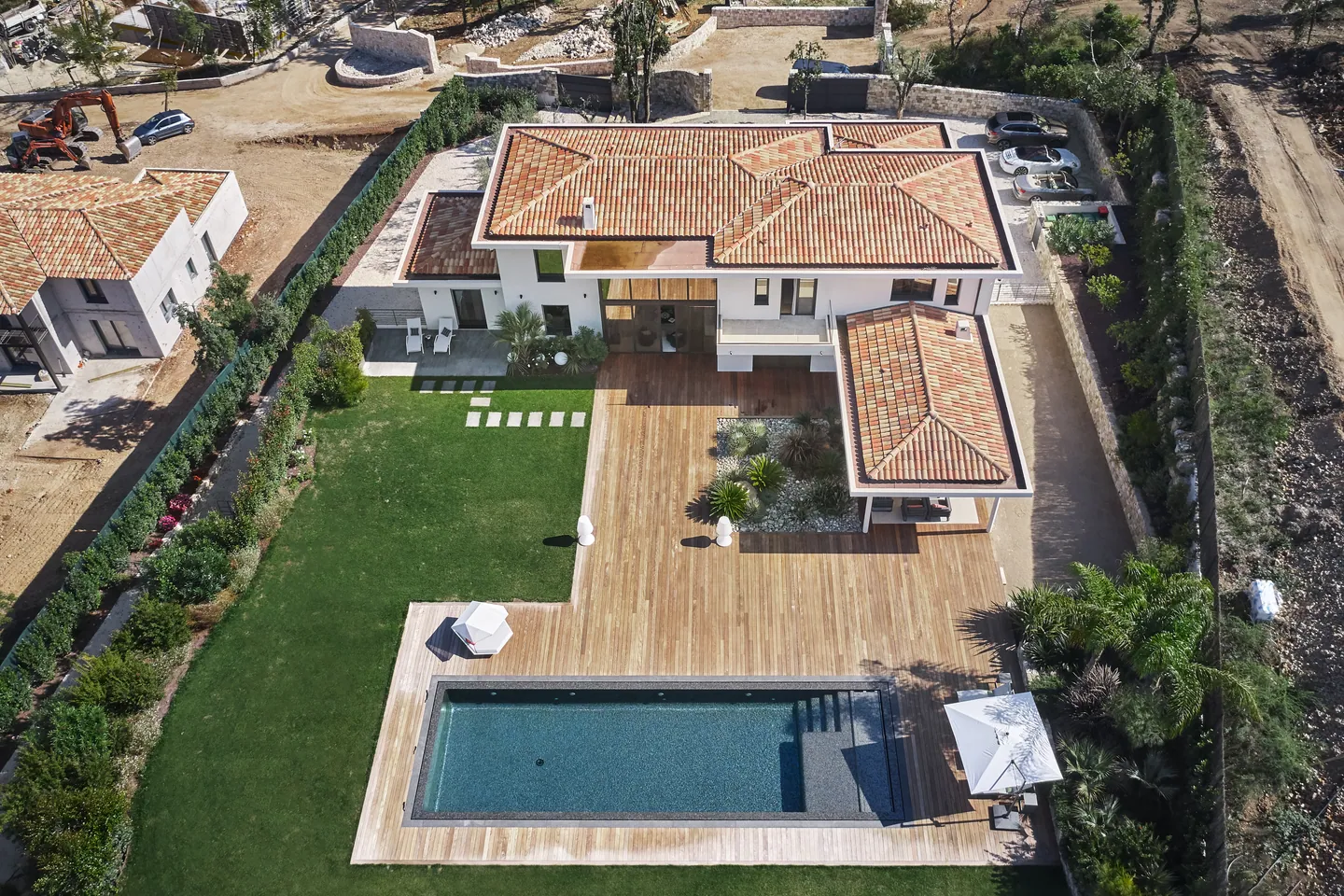 Aerial view of the villa, timber deck and rectangular pool