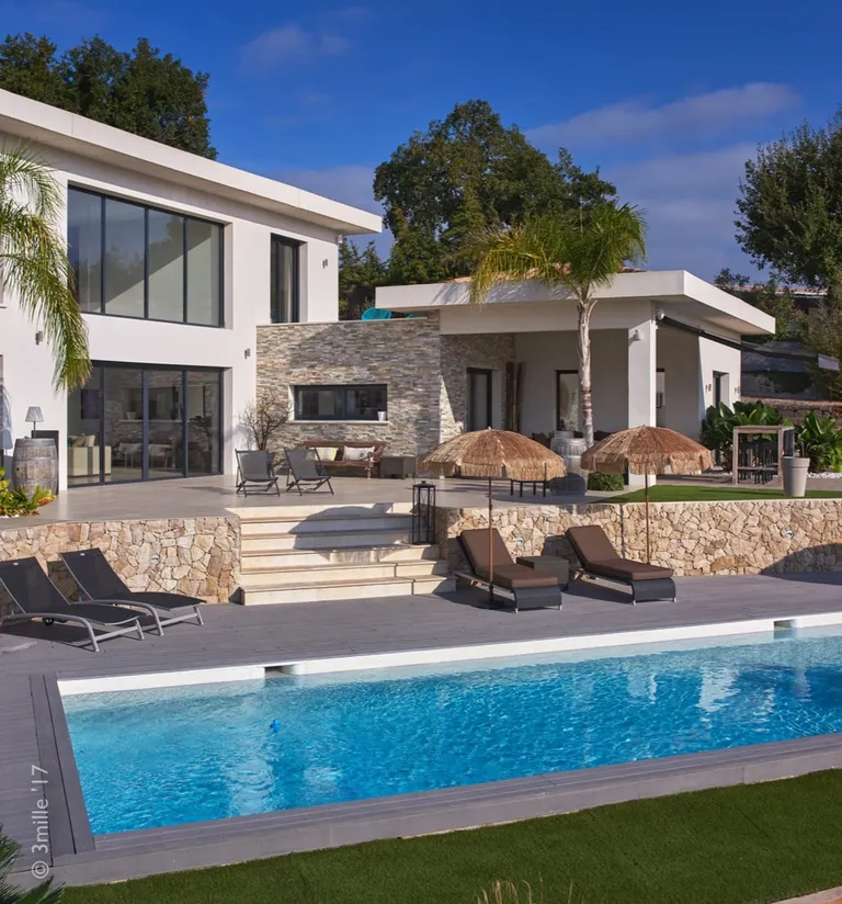 Composite-deck pool surround, stone steps and the villa terrace