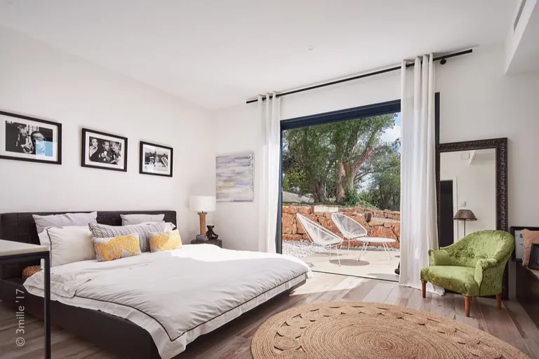 Bedroom opening onto a private terrace and olive garden