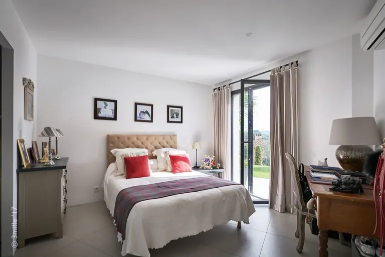 Bedroom with French window opening onto the lawn