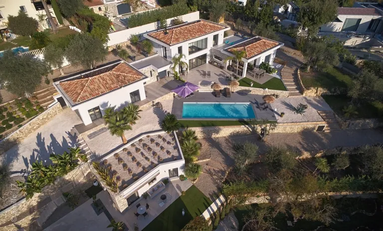 Aerial view of the property: villa, pool, terraces and terraced Mediterranean garden